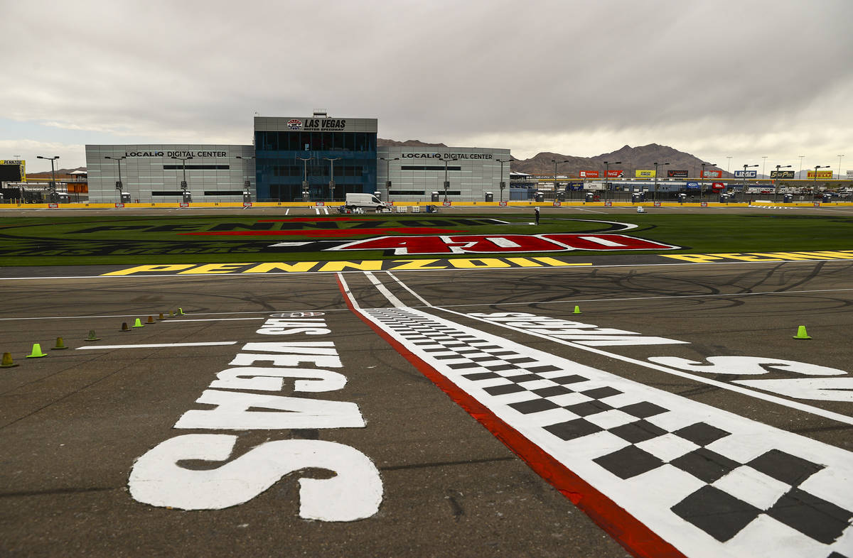 The start/finish line is seen as logos are painted on the infield grass ahead of the Pennzoil 4 ...