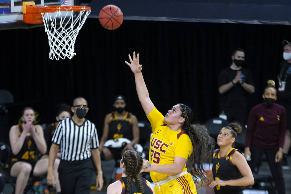 USC Trojans forward Alissa Pili (35) scores a point as Arizona State Sun Devils guard Taya Hans ...