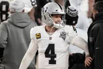 Raiders quarterback Derek Carr (4) celebrates after converting the winning two point conversion ...