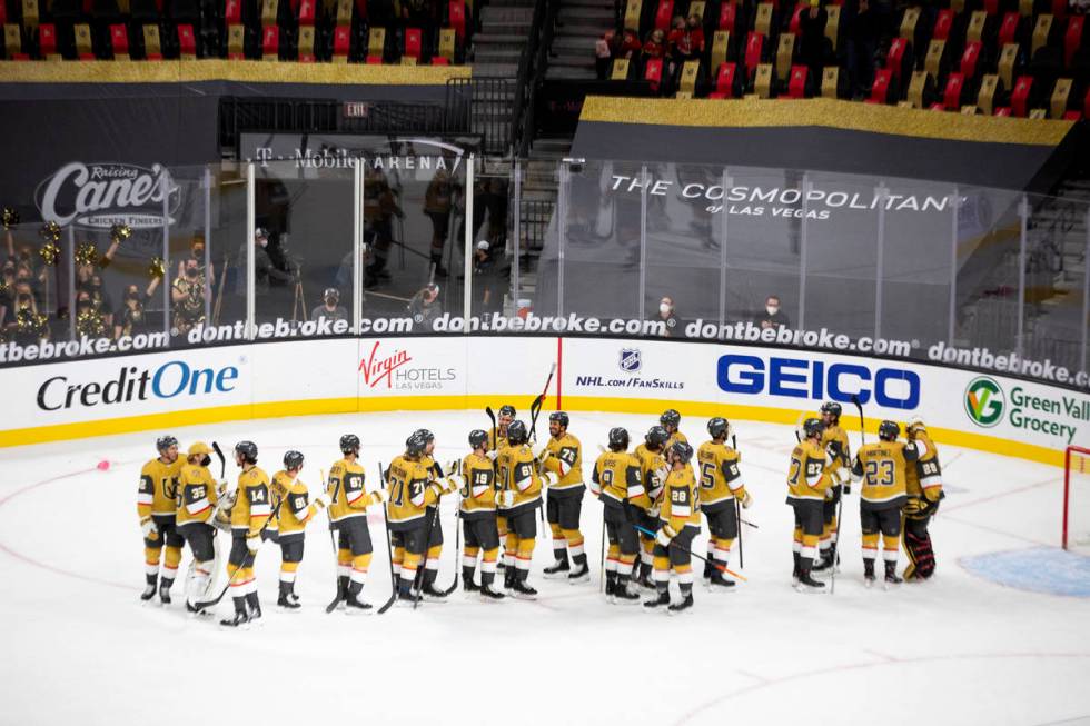 The Golden Knights congratulate each other after winning their NHL hockey game against the Wild ...