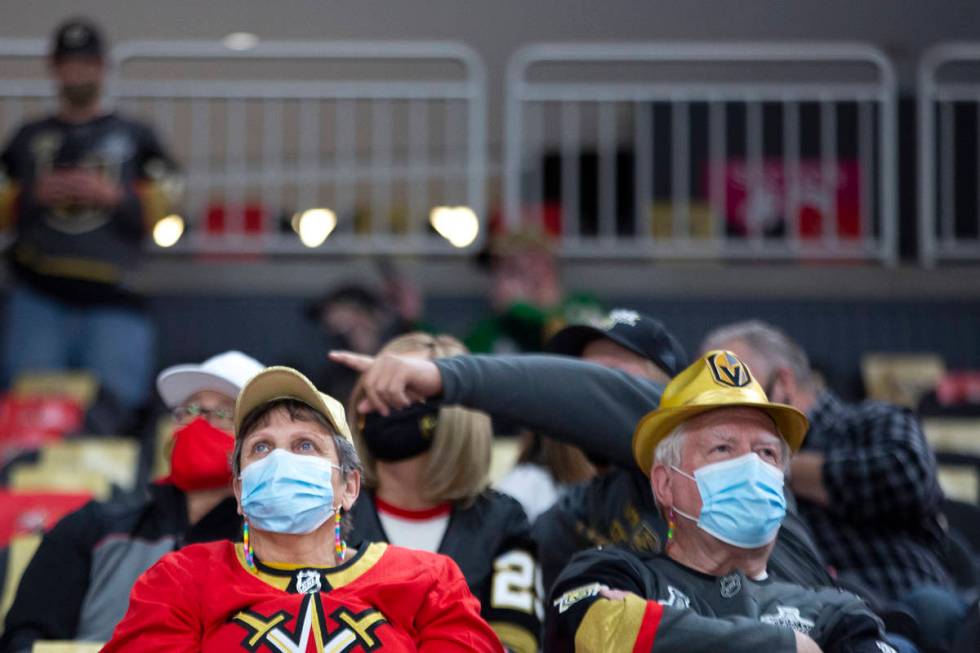 Golden Knights fans wear personal protective equipment to prevent the spread of COVID-19 before ...