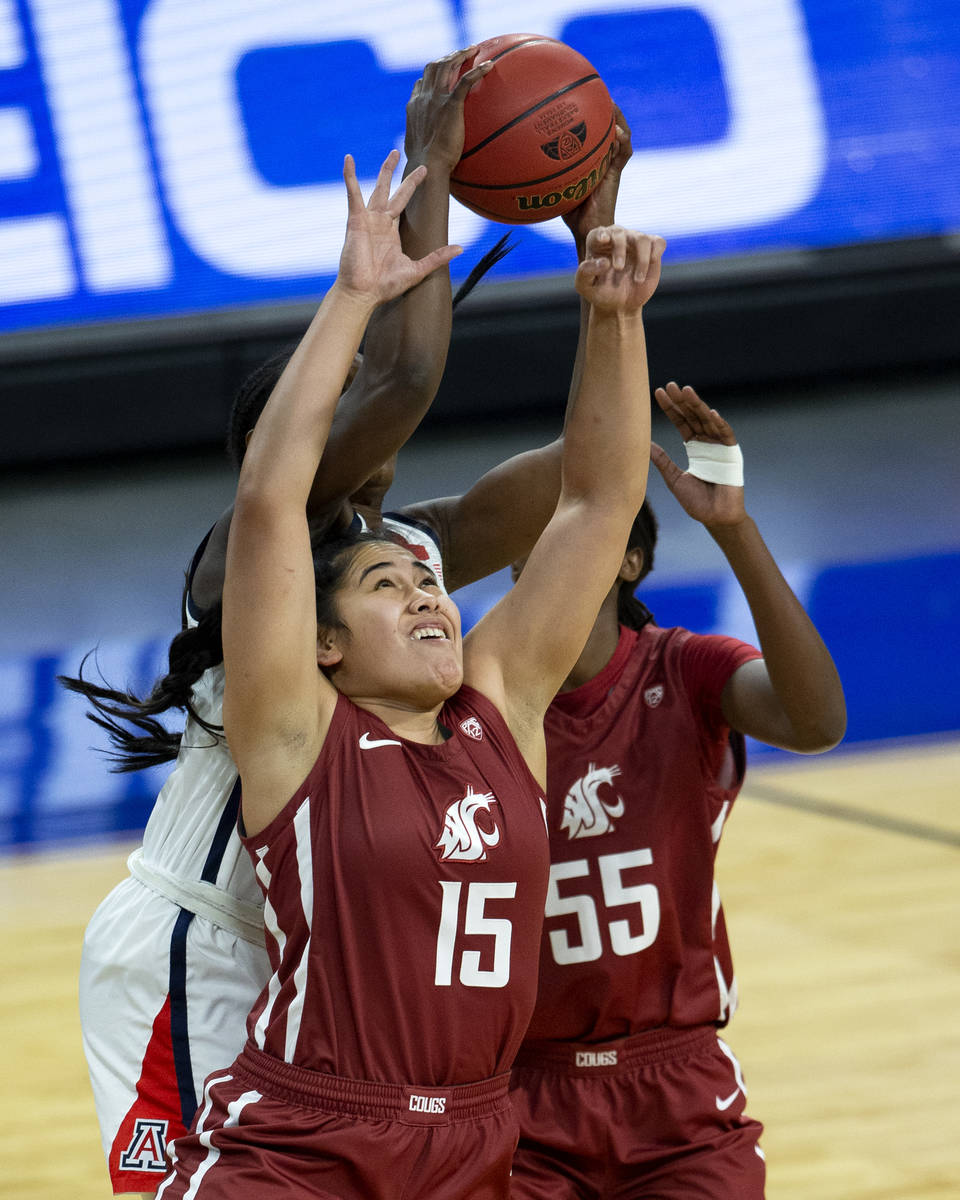 Washington State Cougars forward Ula Motuga (15) and center Bella Murekatete (55) fight with Ar ...