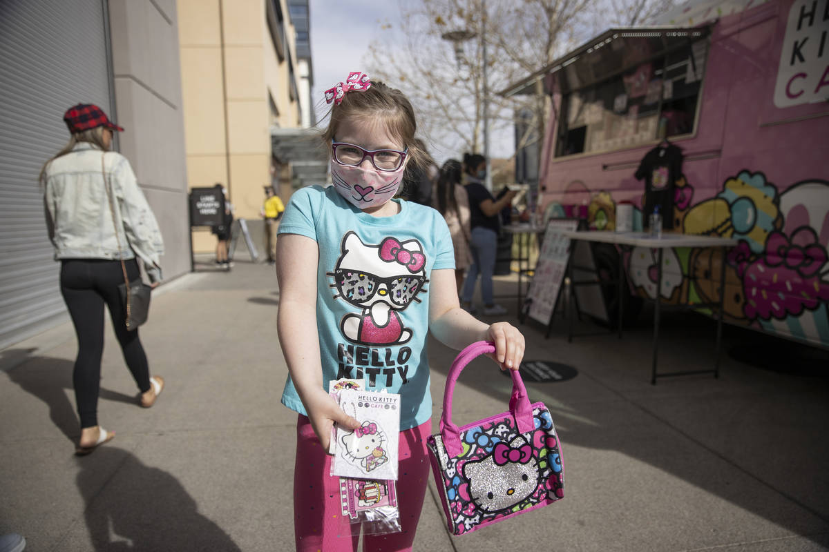 Molly Byrne, 7, of Las Vegas, shows off what her mother Sheila purchased for her from the Hello ...