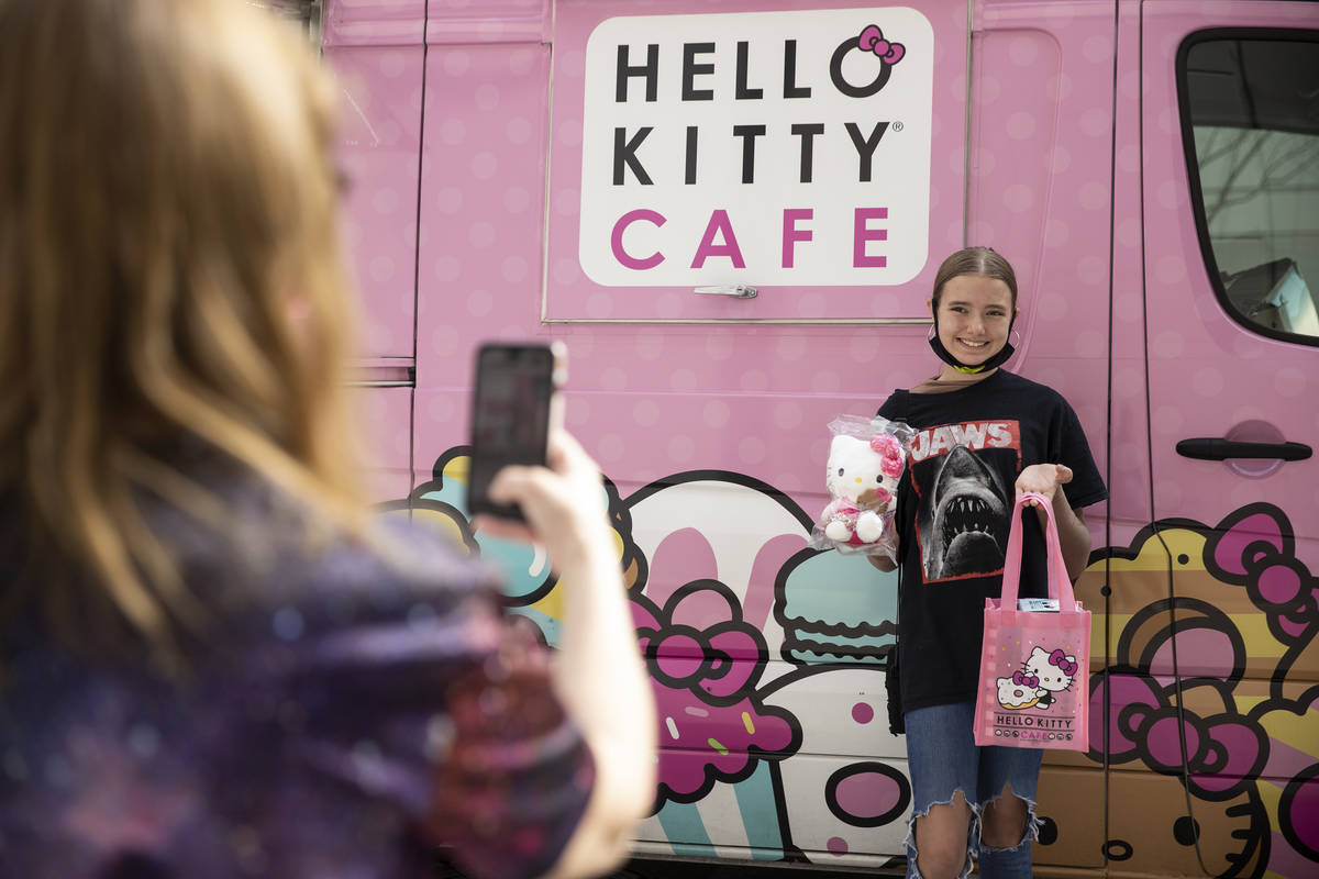 Kara Ness takes a photo of her daughter Ella Ness-Pavlinsky, 13, after visiting the Hello Kitty ...
