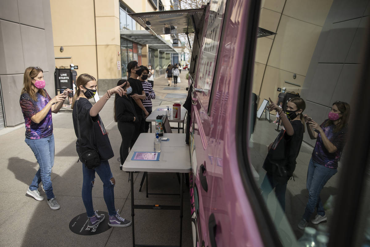Kara Ness, left, and her daughter Ella Ness-Pavlinsky, 13, visit the Hello Kitty Cafe truck at ...