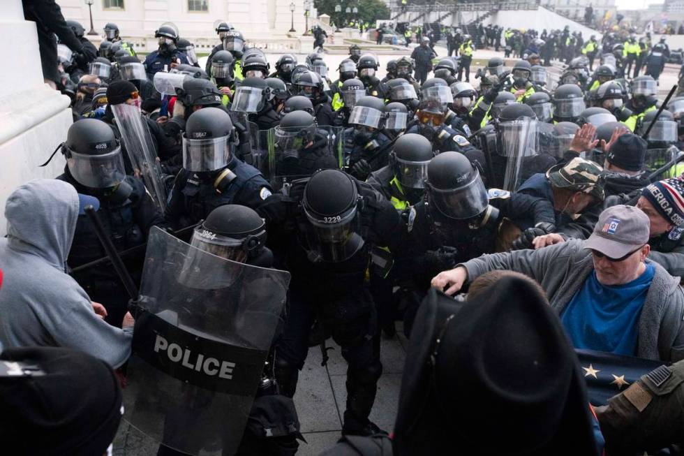 In a Jan. 6, 2021, file photo, U.S. Capitol Police push back rioters trying to enter the U.S. C ...
