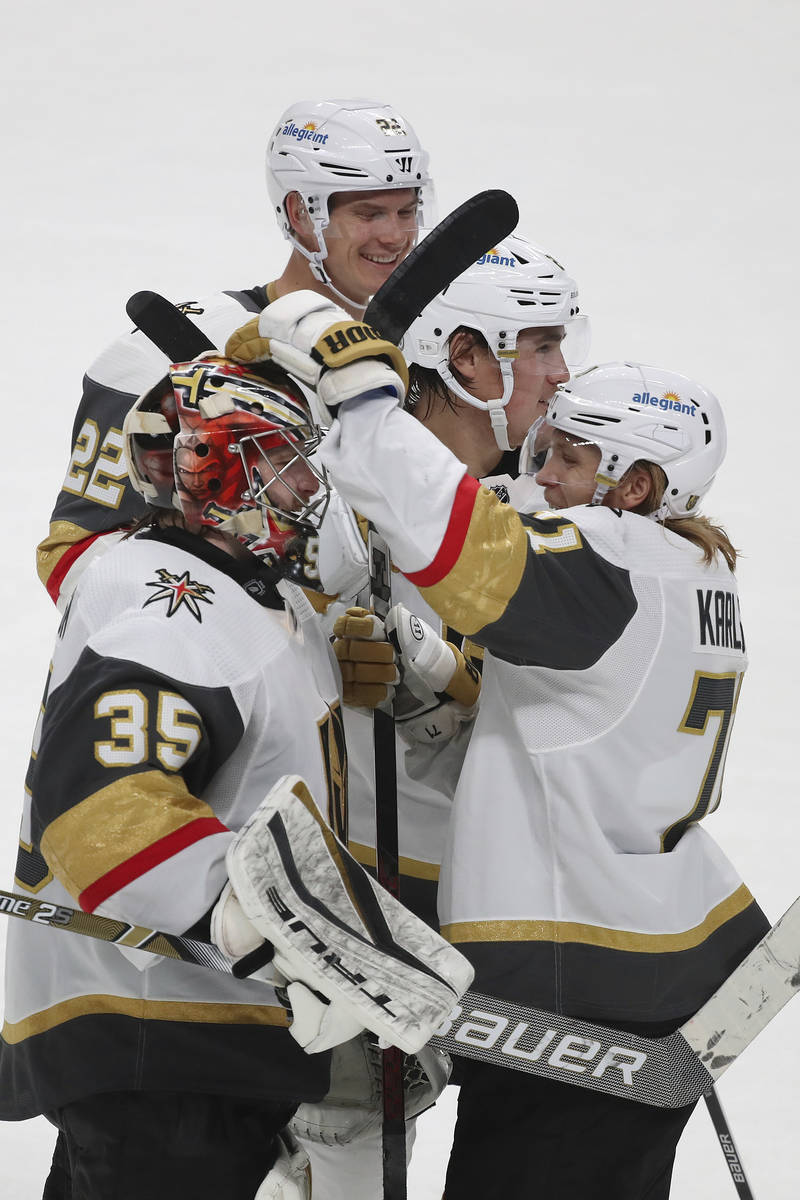 Vegas Golden Knights goaltender Oscar Dansk (35) and teammates celebrate an overtime win agains ...