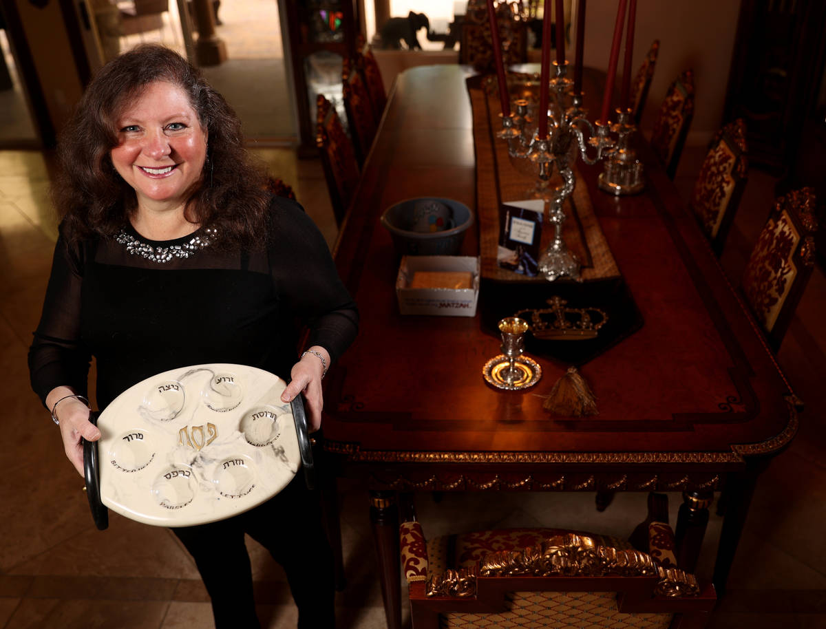 Michele Morgan-Devore shows a Seder plate at her Las Vegas home, where she usually has 30 peopl ...