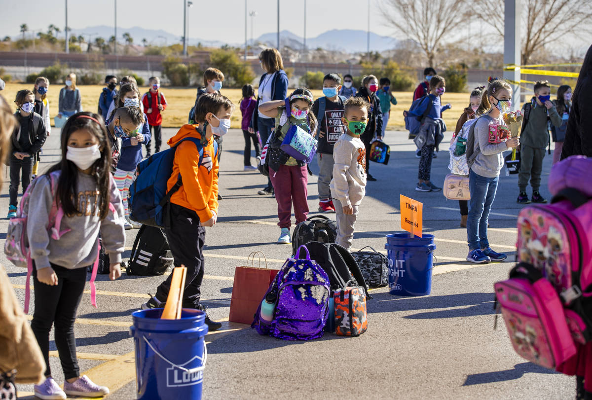 Students stand in lines on the playground assigned by their teachers at Goolsby Elementary Scho ...