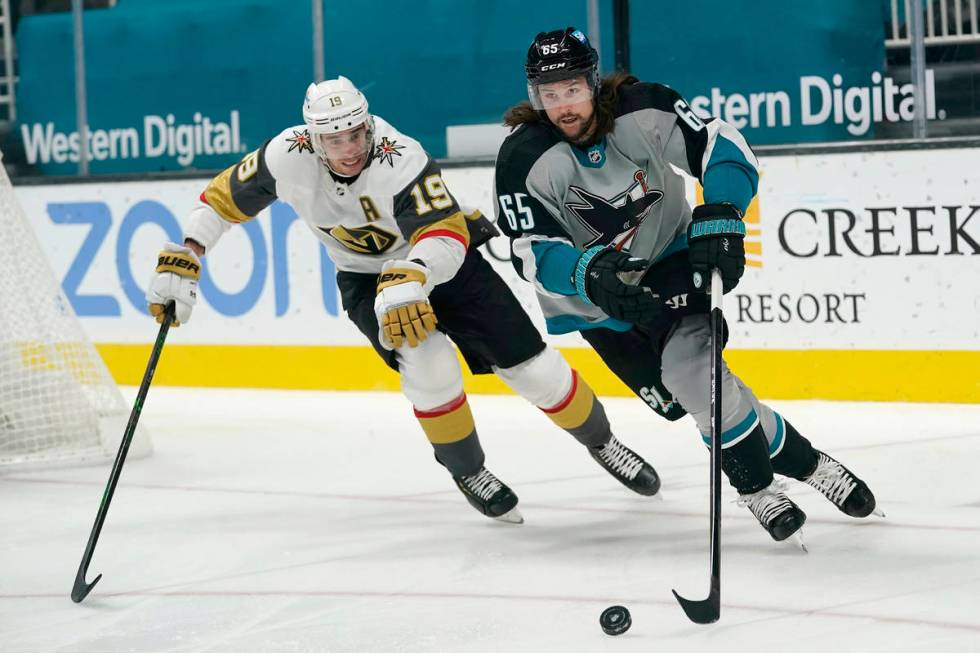 San Jose Sharks defenseman Erik Karlsson, right, skates in front of Vegas Golden Knights right ...