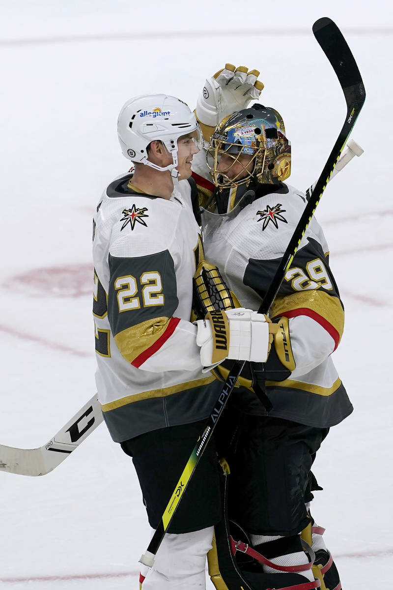 Vegas Golden Knights defenseman Nick Holden (22) celebrates with goaltender Marc-Andre Fleury ( ...