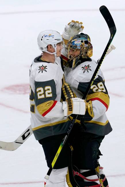 Vegas Golden Knights defenseman Nick Holden (22) celebrates with goaltender Marc-Andre Fleury ( ...