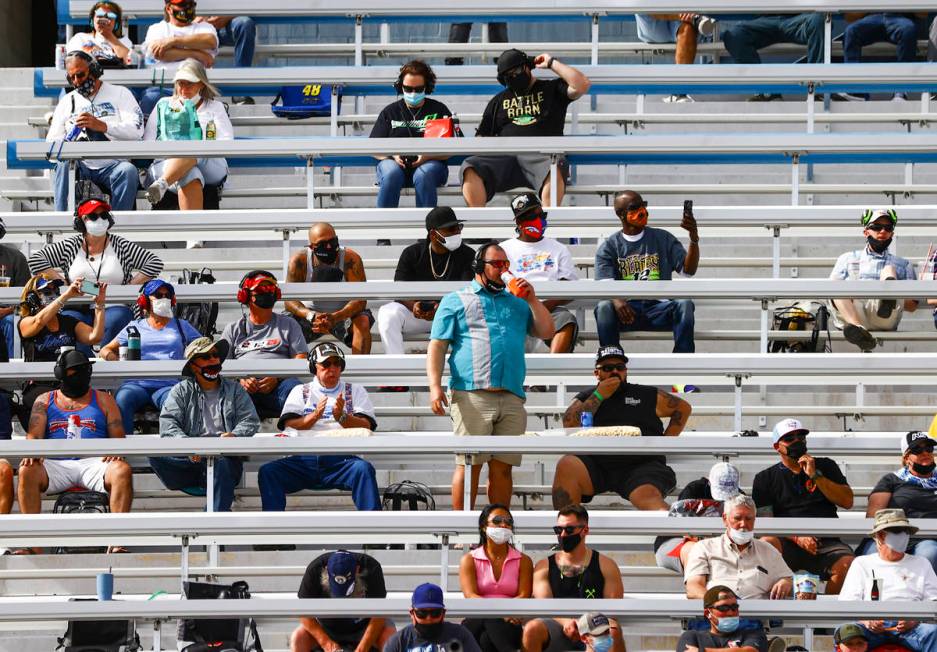 Fans take in the action during a NASCAR Xfinity Series auto race at the Las Vegas Motor Speedwa ...