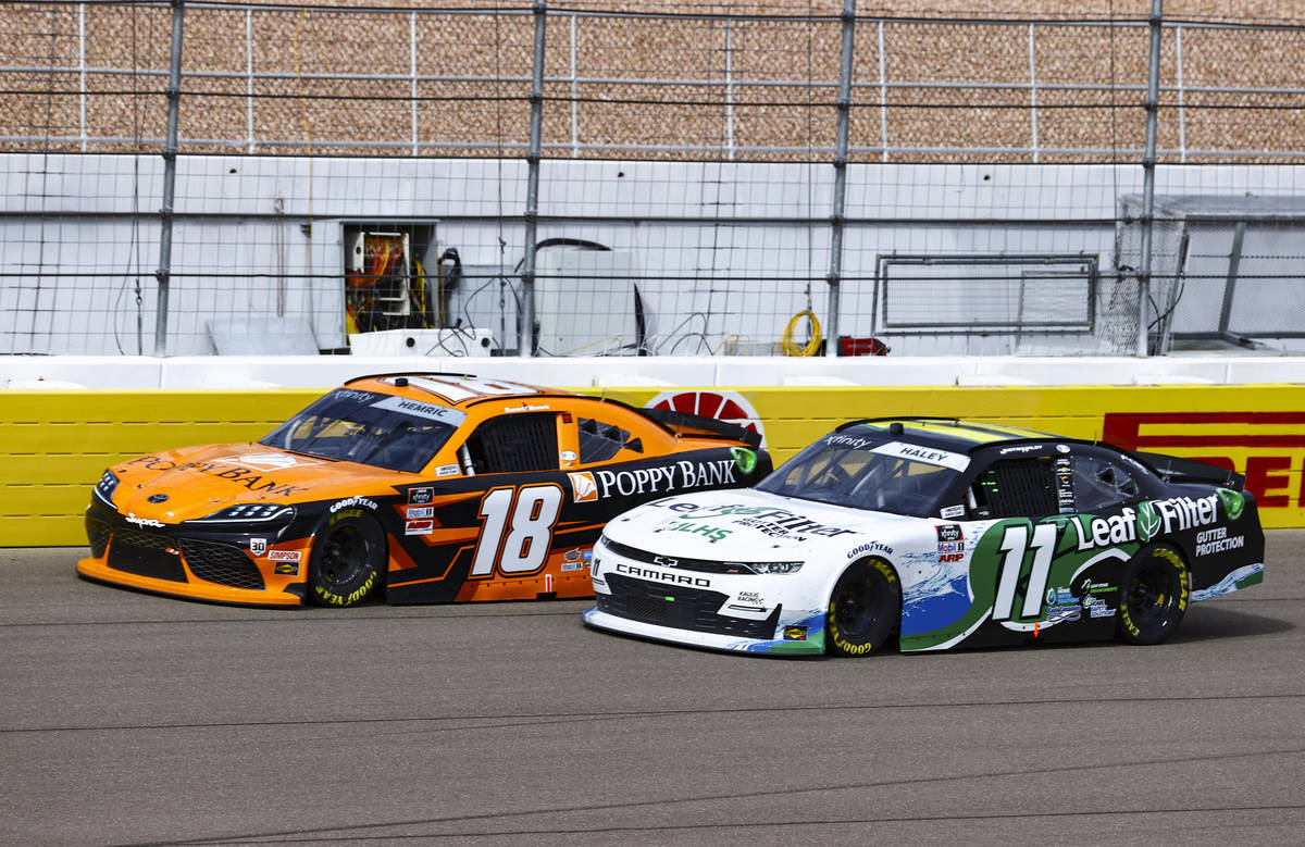 Daniel Hemric (18) maintains a lead over Justin Haley (11) during a NASCAR Xfinity Series auto ...