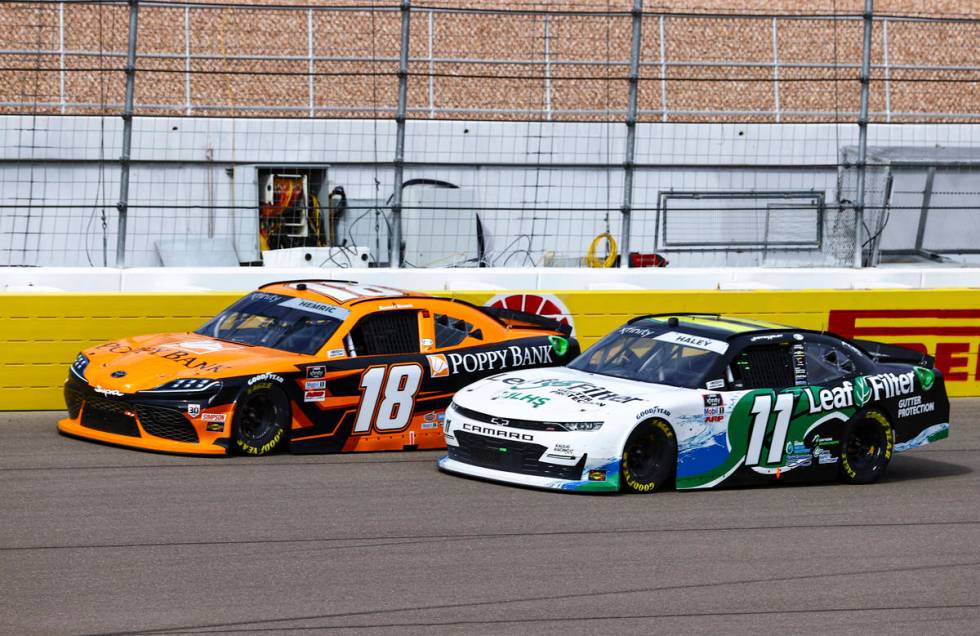 Daniel Hemric (18) maintains a lead over Justin Haley (11) during a NASCAR Xfinity Series auto ...