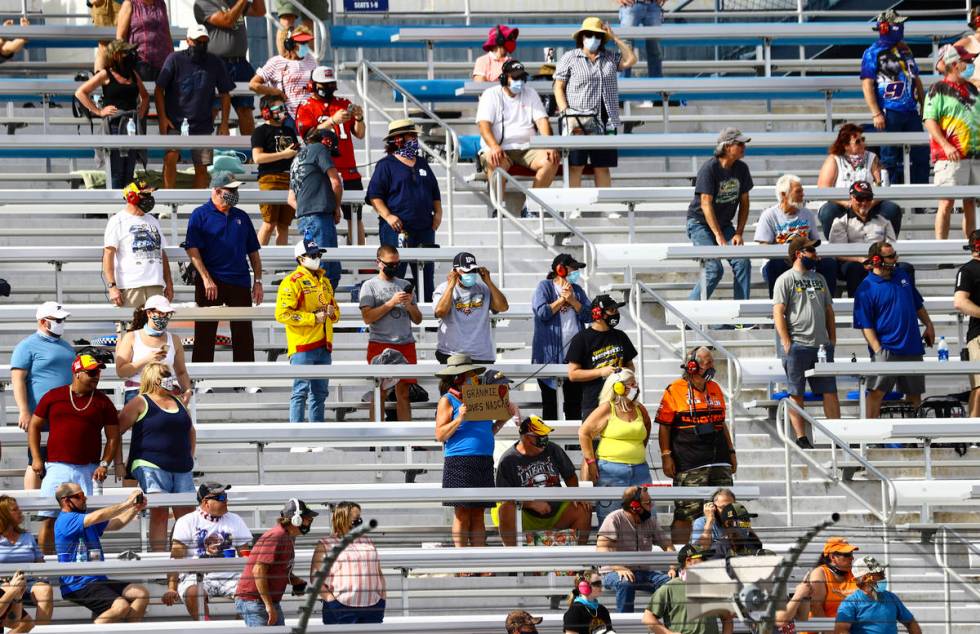 Fans take in the action during a NASCAR Xfinity Series auto race at the Las Vegas Motor Speedwa ...