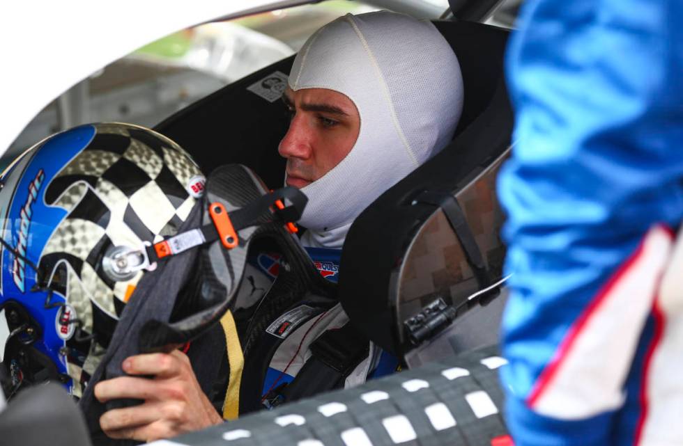 Austin Cindric gets ready to put on his helmet before a NASCAR Xfinity Series auto race at the ...