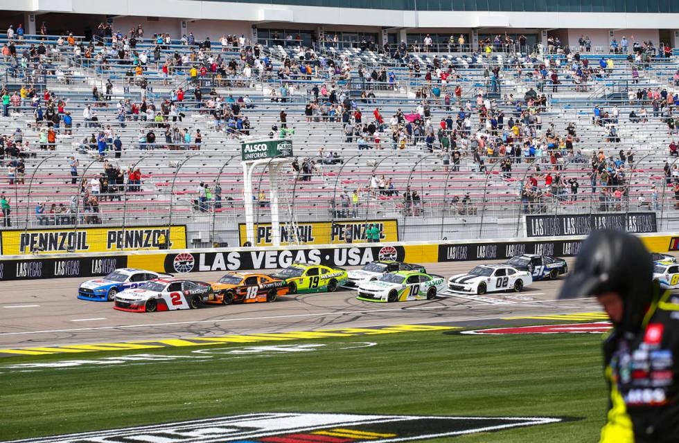 The green flag is waved at the start of a NASCAR Xfinity Series auto race at the Las Vegas Moto ...