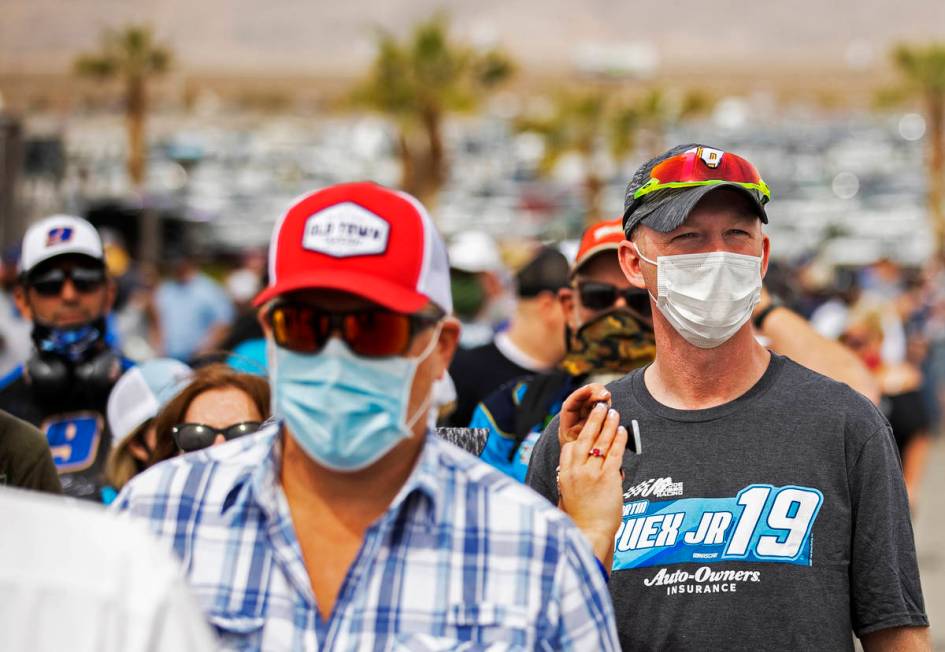 NASCAR fans wait in line to get their tickets scanned before the start of the NASCAR Cup Series ...