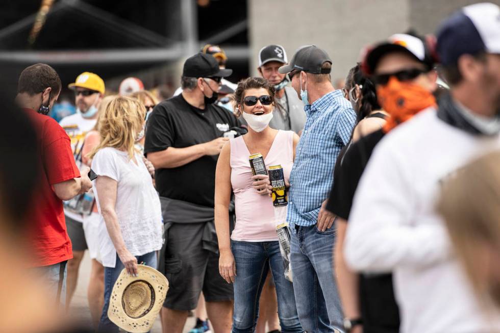NASCAR fans socialize before the start of the NASCAR Cup Series Pennzoil 400 auto race at Las V ...
