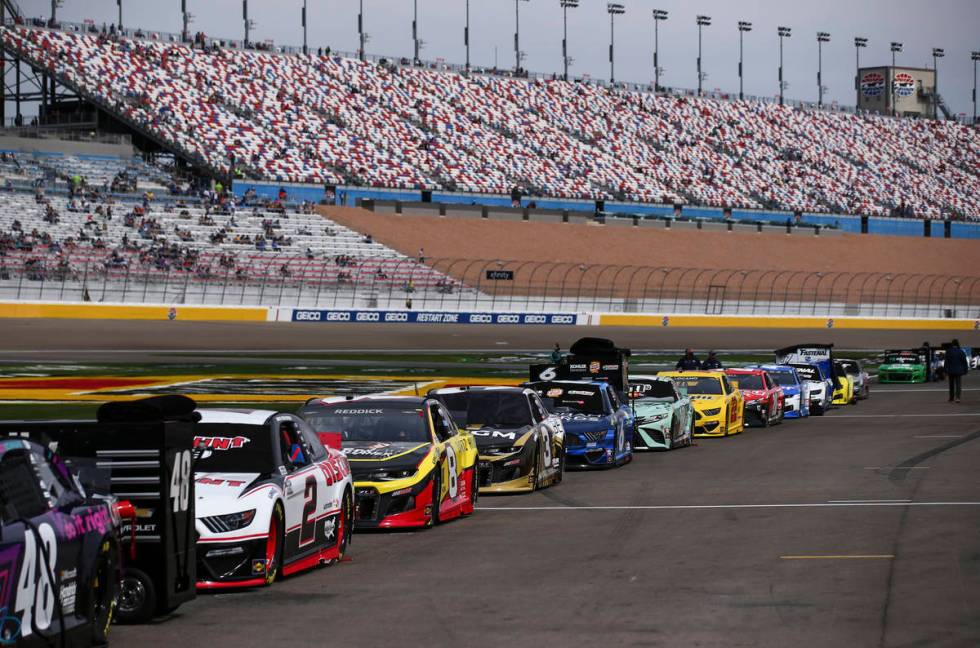 Cars are lined up in pit road before the NASCAR Cup Series Pennzoil 400 auto race at the Las Ve ...