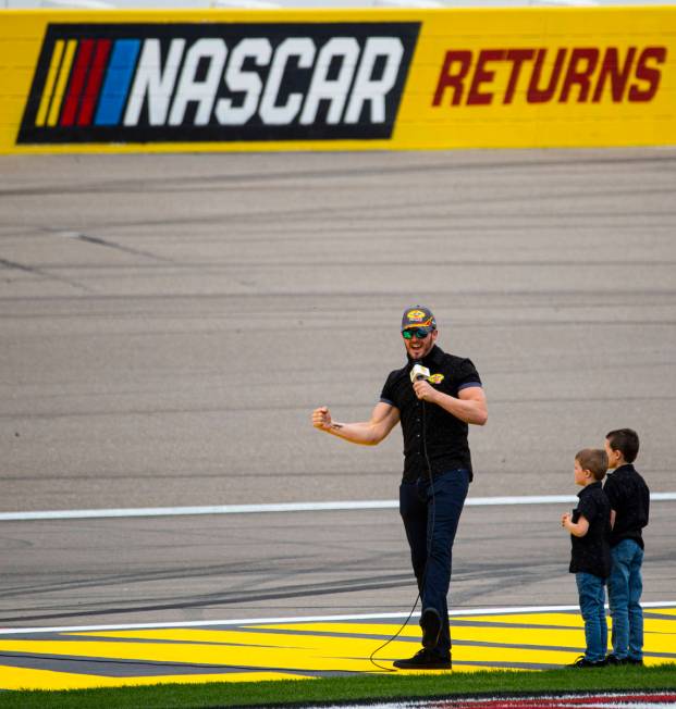 Raiders quarterback Derek Carr tells drivers to start their engines for a NASCAR Cup Series Pen ...