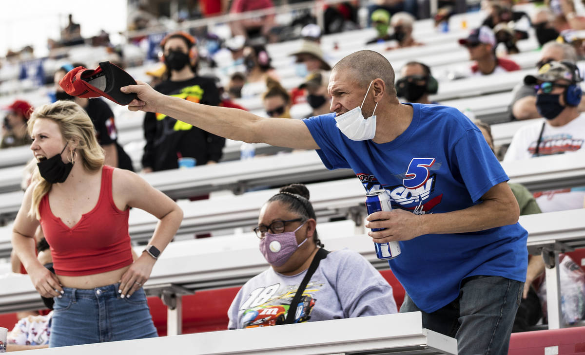 Fans cheer from the grandstands during the NASCAR Cup Series Pennzoil 400 auto race at Las Vega ...