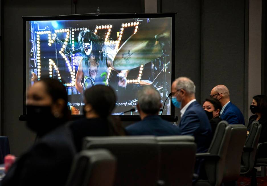 Attendees look to a video before a marketing presentation during a Las Vegas Convention and Vis ...