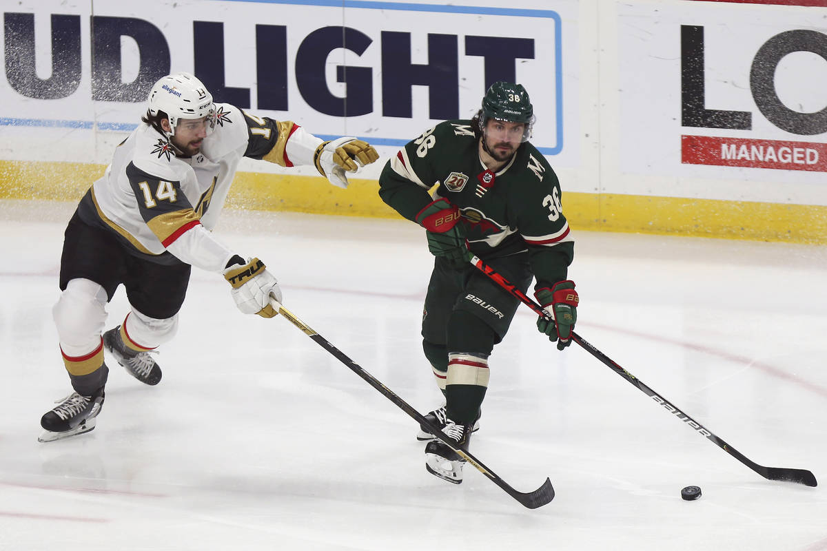 Minnesota Wild's Mats Zuccarello (36) handles the puck against Vegas Golden Knights' Nicolas Ha ...