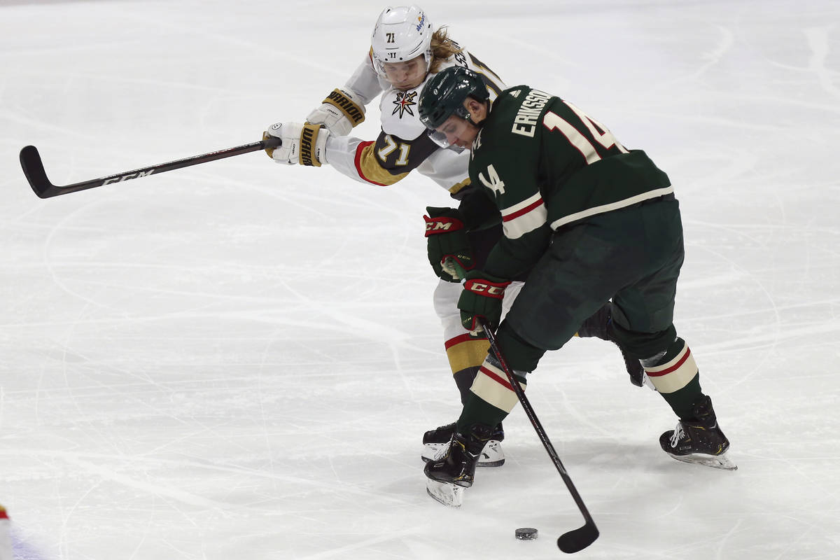 Minnesota Wild's Joel Eriksson Ek (14), of Sweden, handles the puck against Vegas Golden Knight ...