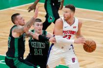 Boston Celtics' Daniel Theis (27) and Payton Pritchard (11) defend against Detroit Pistons' Bla ...