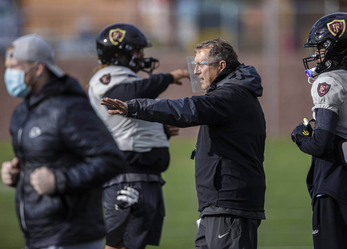 Faith Lutheran head football coach Mike Sanford leads practice on Thursday, March 11, 2021, at ...