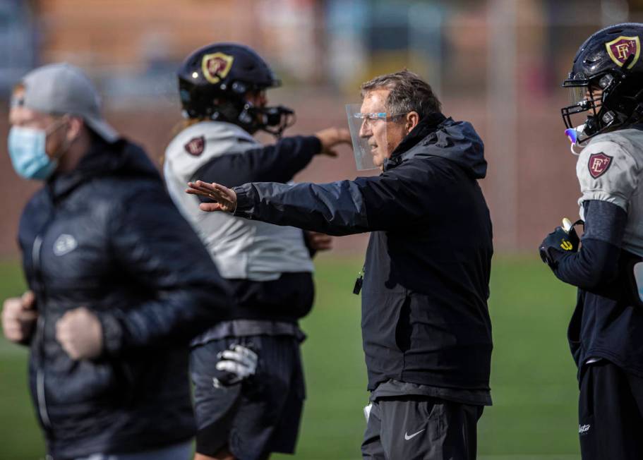 Faith Lutheran head football coach Mike Sanford leads practice on Thursday, March 11, 2021, at ...