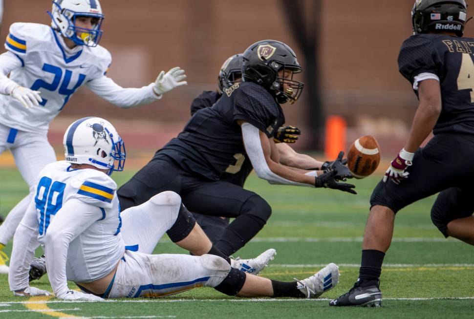 Faith LutheranÕs Josh Goynes looks in an interception versus Moapa Valley during the first ...