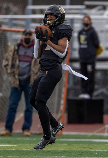 Faith LutheranÕs Josh Goynes looks in a long pass versus Moapa Valley during the first qua ...