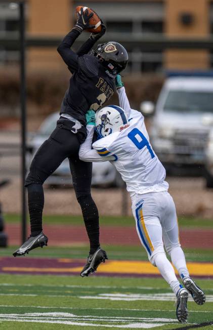 Faith LutheranÕs Jaden Rhodes (2) intercepts a long pass to Moapa ValleyÕs Austin Hei ...