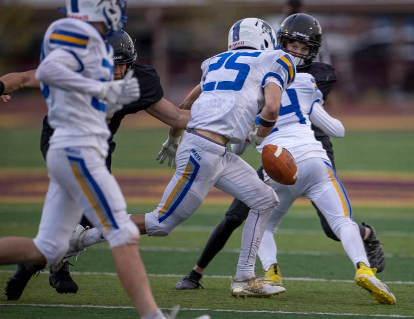 Moapa ValleyÕs Jayme Carvajal (25) fumbles the ball versus Faith Lutheran during the first ...