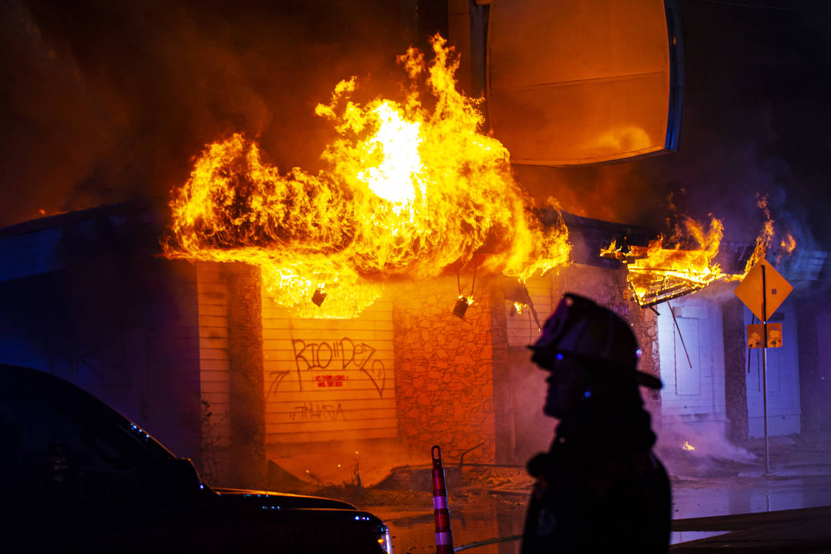 Las Vegas firefighters battle flames engulfing a vacant wedding chapel at 1431 S. Las Vegas Blv ...