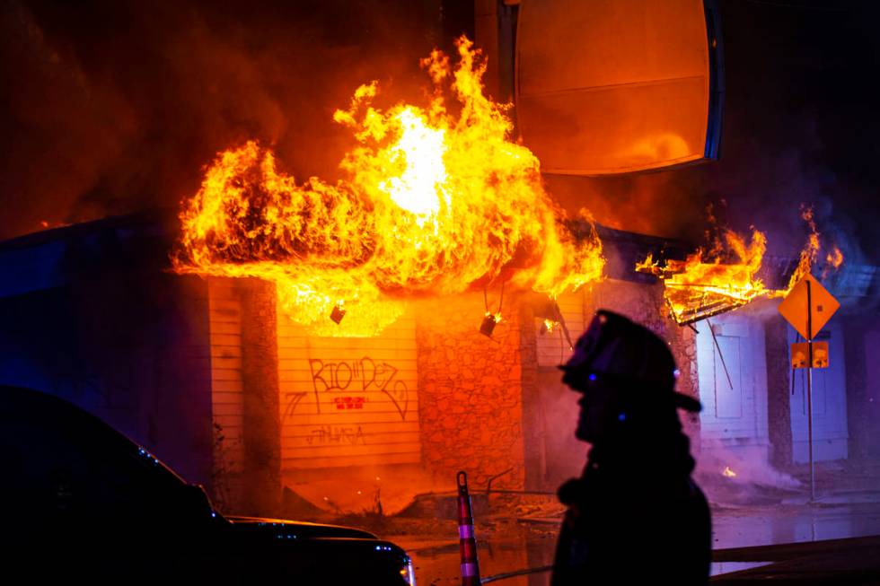 Las Vegas firefighters battle flames engulfing a vacant wedding chapel at 1431 S. Las Vegas Blv ...