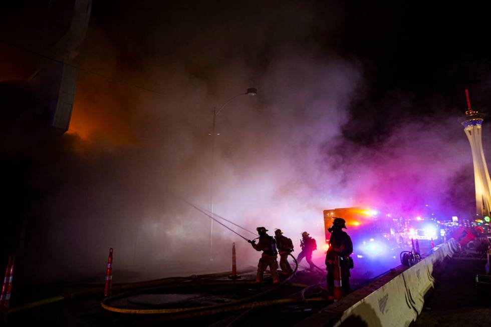 Las Vegas firefighters battle flames engulfing a vacant wedding chapel at 1431 S. Las Vegas Blv ...