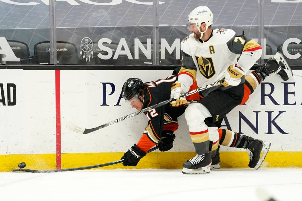 Vegas Golden Knights defenseman Alex Pietrangelo, right, puts Anaheim Ducks left wing Sonny Mil ...