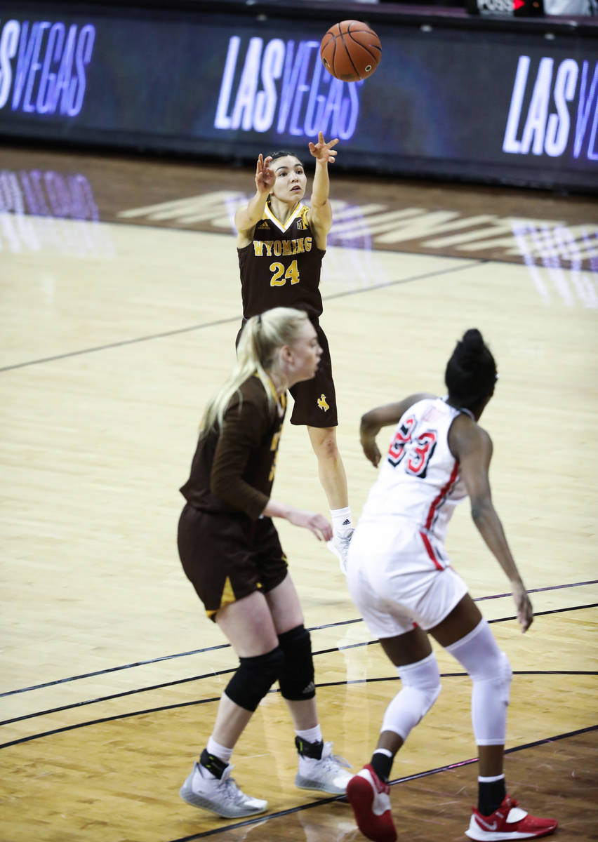 Wyoming guard Tommi Olson (24) shoots a three point field goal against UNLV in the second half ...