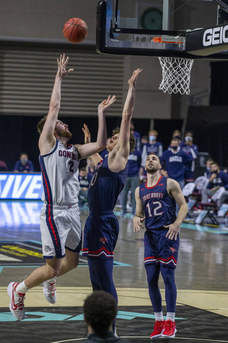 Gonzaga Bulldogs forward Drew Timme (2) makes a shot as St. Mary's Gaels center Mitchell Saxen ...