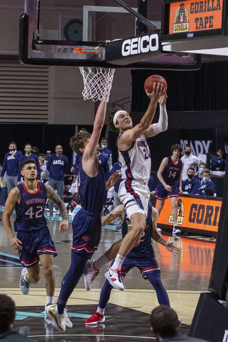 Gonzaga Bulldogs forward Corey Kispert (24) makes a shot as St. Mary's Gaels center Mitchell Sa ...