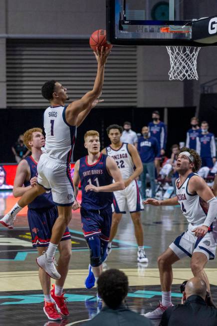 Gonzaga Bulldogs guard Jalen Suggs (1) makes a shot as St. Mary's Gaels forward Matthias Tass ( ...