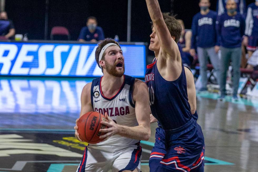 Gonzaga Bulldogs forward Drew Timme (2) looks to shoot as St. Mary's Gaels center Mitchell Saxe ...