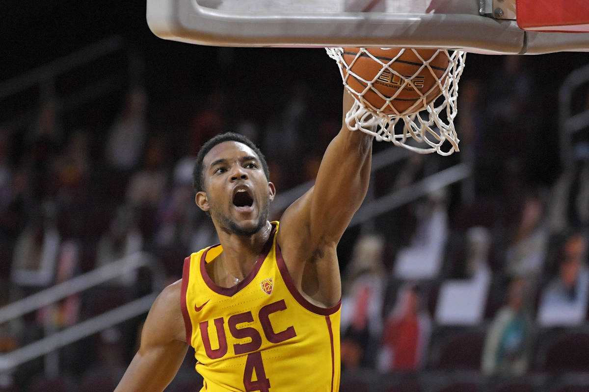FILE - In this Feb. 17, 2021, file photo, Southern California forward Evan Mobley dunks during ...
