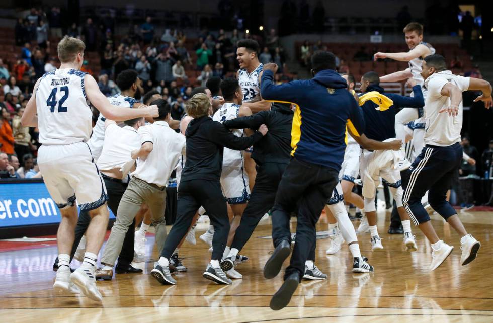 UC Irvine players celebrate after the team defeats Cal State Fullerton 92-64 during the second ...