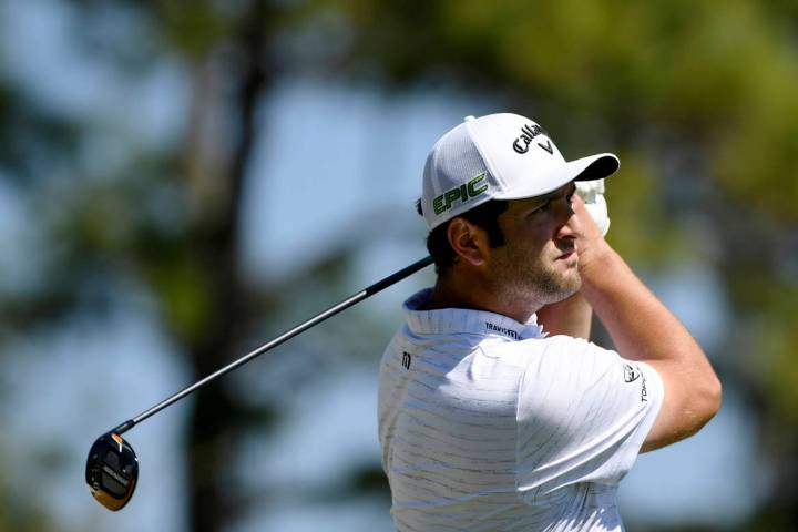 Jon Rahm, of Spain, hits from the first tee during the first round of the Workday Championship ...