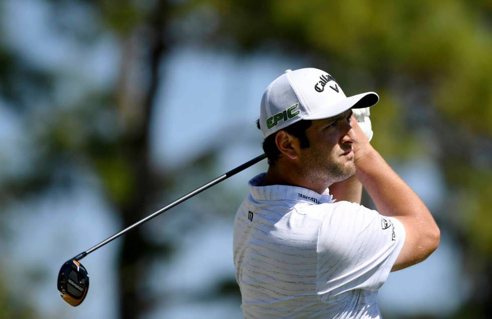 Jon Rahm, of Spain, hits from the first tee during the first round of the Workday Championship ...